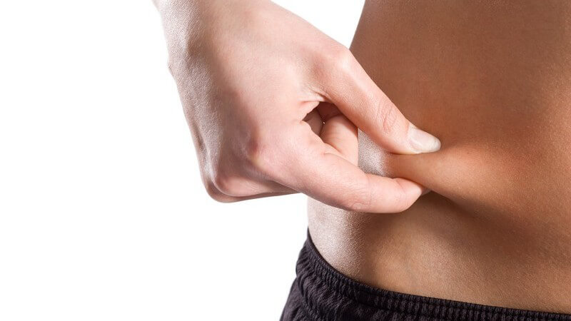 Abnehmen - Speckfalte vom Bauch zwischen den Fingern
